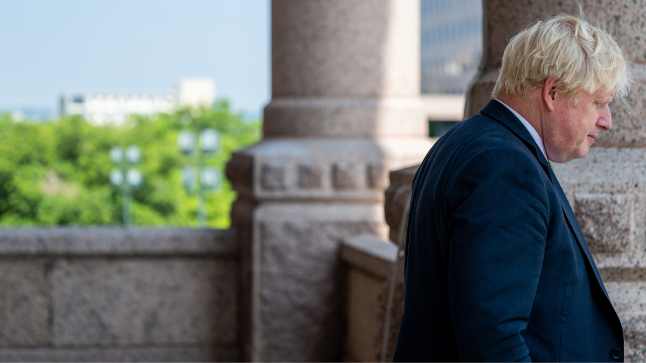 Boris Johnson pictured standing on a balcony at the Texas State Capitol 