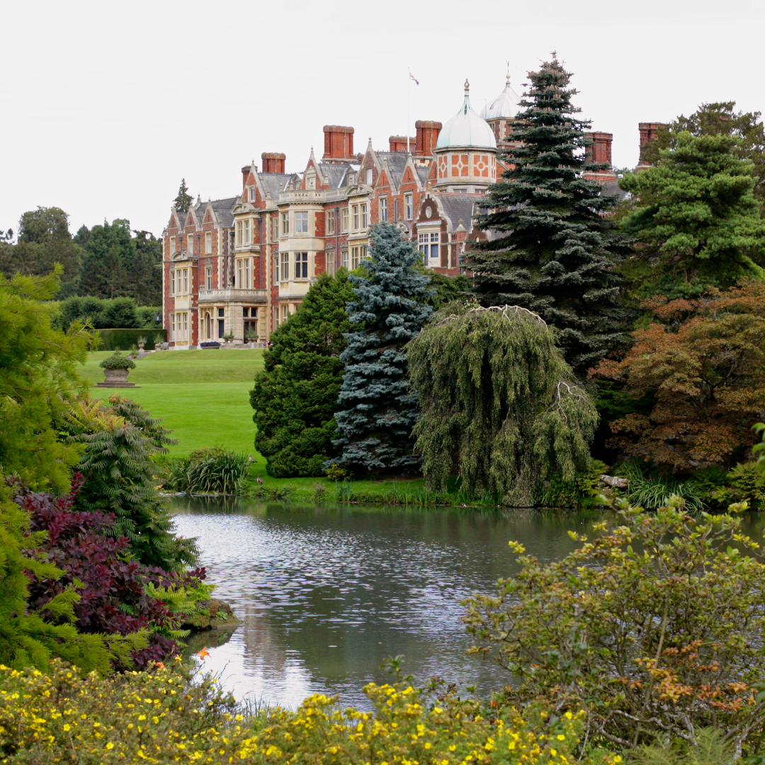 Exterior of Sandringham House with a pond in front