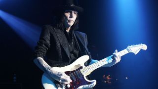 A shot of mick mars on stage