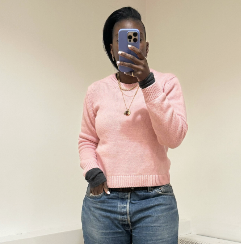 Nikki Ogunnaike wearing a pink sweater and jeans