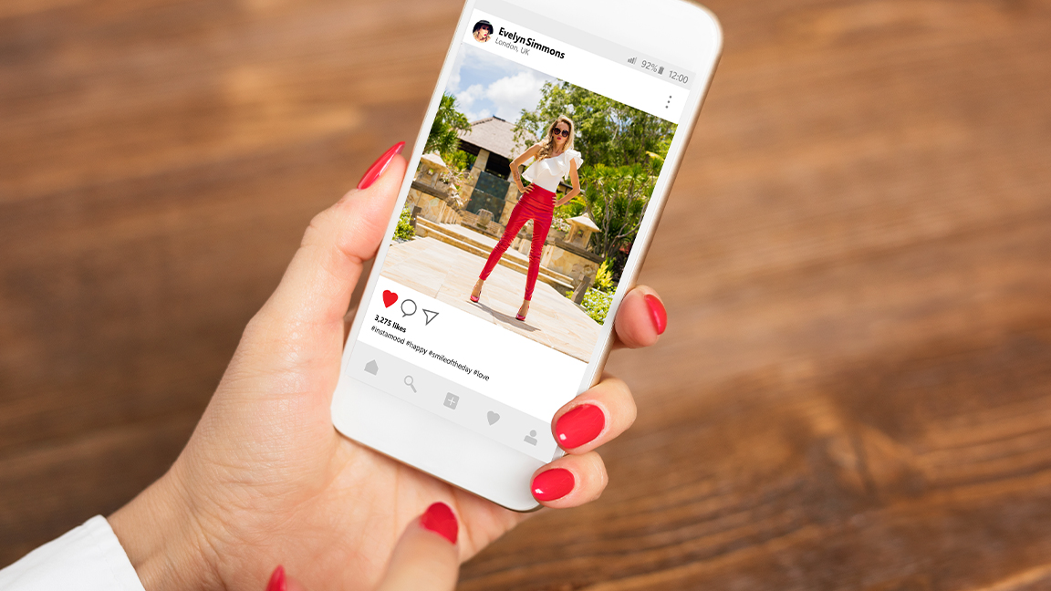 A photo of a woman taking a photo on her phone