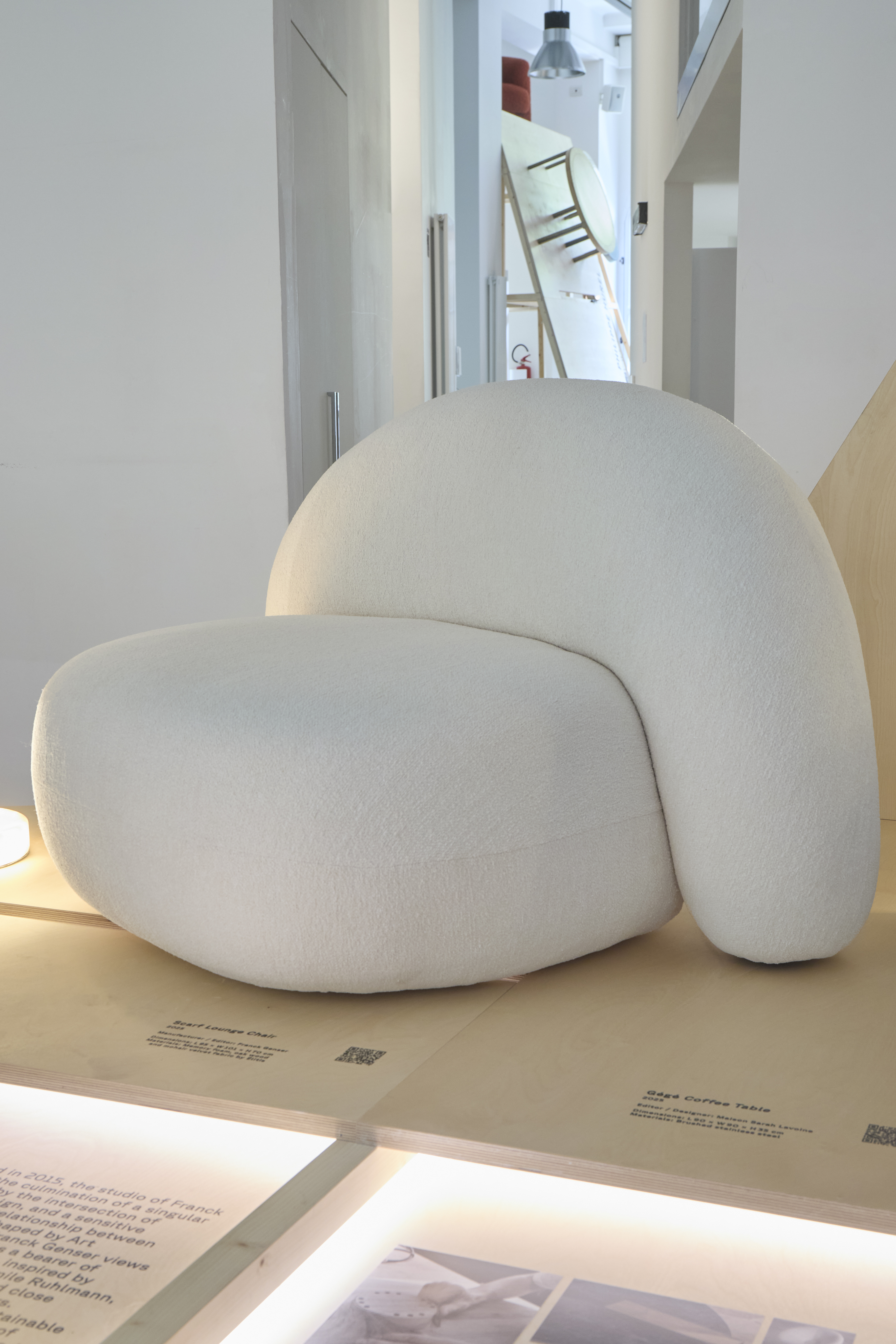 furniture and lighting displayed on timber platform