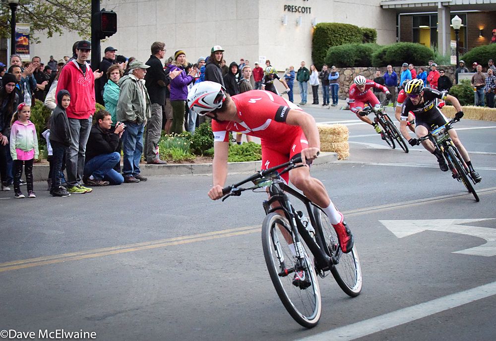 Sam Gaze (Specialized) checks behind him on the final turn of the race