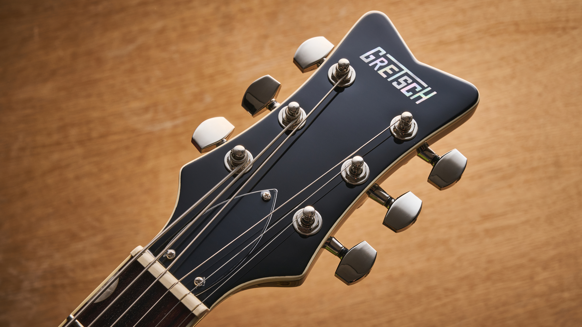 Gretsch Electromatic CVT Baritone in Bristol Fog brown sunburst finish shot on wood.