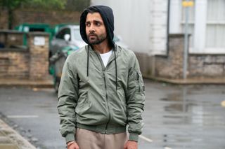 Vinny Panesar in Albert Square wearing a hoodie