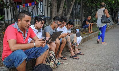 Cubans on their mobile devices.