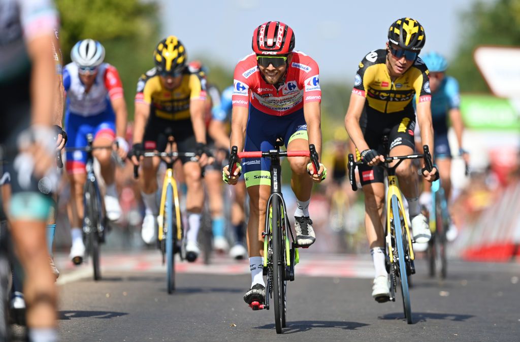 VILLANUEVA DE LA SERENA SPAIN AUGUST 27 Odd Christian Eiking of Norway and Team Intermarch Wanty Gobert Matriaux red leader jersey crosses the finishing line during the 76th Tour of Spain 2021 Stage 13 a 2037km stage from Belmez to Villanueva de la Serena lavuelta LaVuelta21 on August 27 2021 in Villanueva de la Serena Spain Photo by Stuart FranklinGetty Images