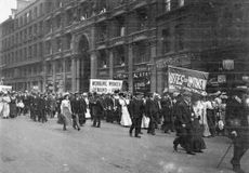 Male and female members of the women's suffrage movement on a protest march through London