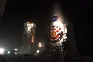 NASA's InSight Mars lander, tucked inside its protective payload fairing, is moved to the launchpad to be attached to its United Launch Alliance Atlas V rocket at Vandenberg Air Force Base in California. The mission will launch on May 5, 2018.