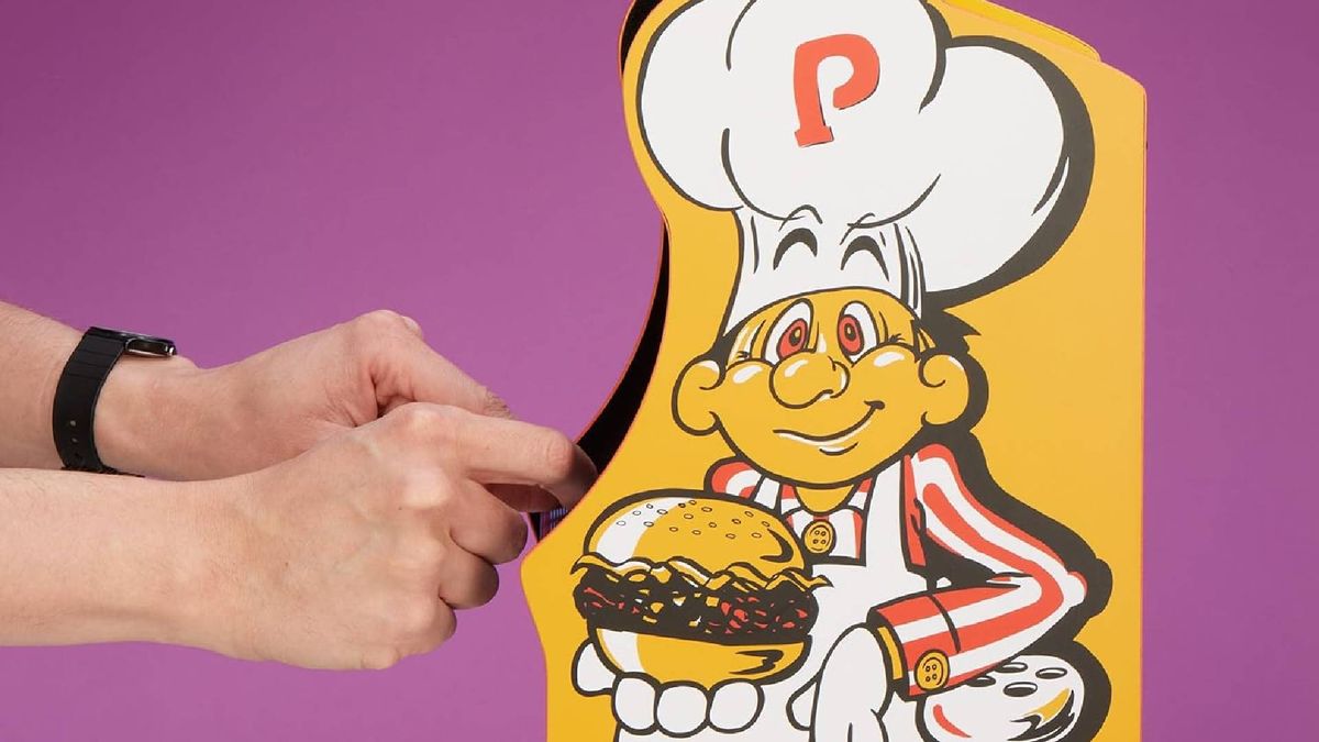 Close up of Quarter Arcades Burger Time side art with hands using controls.