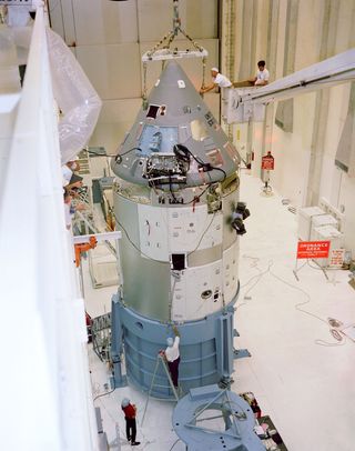 Apollo Spacecraft 12 Command/Service Module is moved from H-134 to east stokes for mating to the Saturn Lunar Module Adapter No. 05 in the Manned Spacecraft Operations Building. Spacecraft 12 was to have flown on the Apollo/Saturn 204 mission (later known