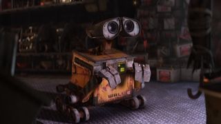 Wall-E watches TV with yearning in WALL-E