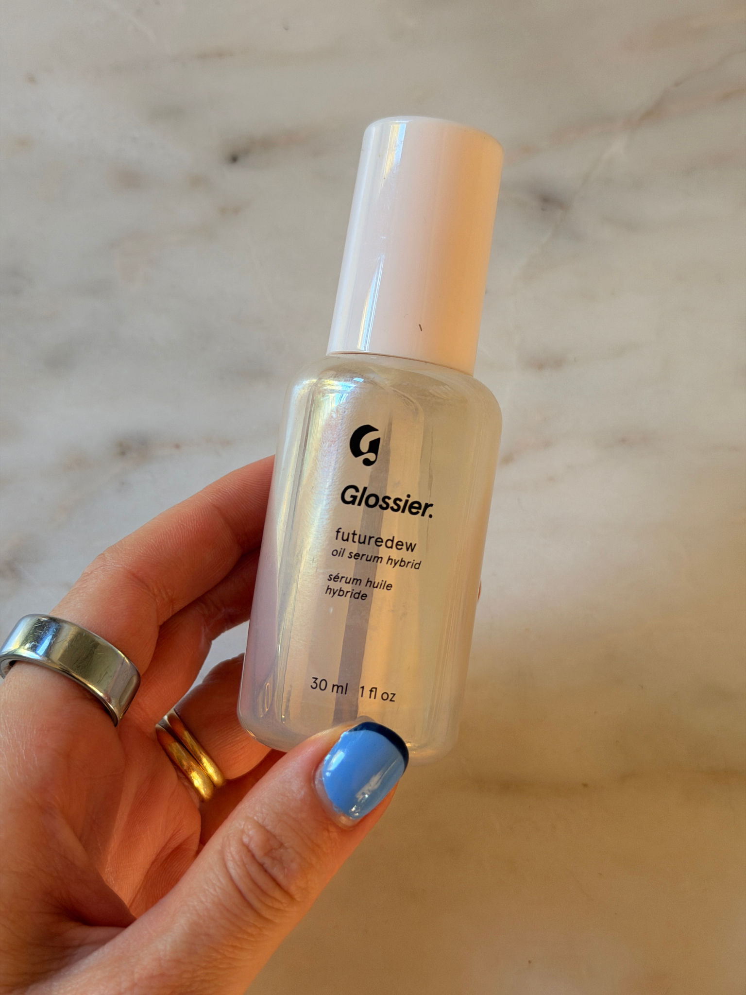 Freelance beauty editor Grace Day holding the Glossuer primer.