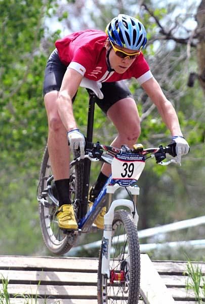 Willow Koerber (Gary Fisher/Subaru) heads down the ramp. Georgia Gould (Luna Women's MTB) descends the wooden ramp.