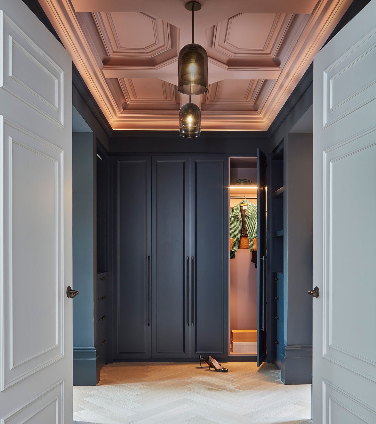 a hallway with a painted ceiling