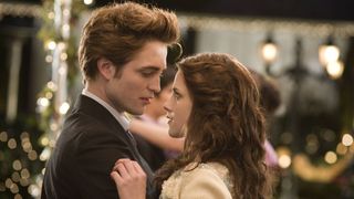 Robert Pattinson as Edward Cullen and Kristen Stewart as Bella Swan in Twilight