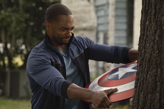 Sam Wilson (Anthony Mackie) attempts to remove Captain America&#039;s shield after getting it embedded in a tree