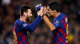 Lionel Messi and Luis Suarez of Barcelona celebrate after a goal