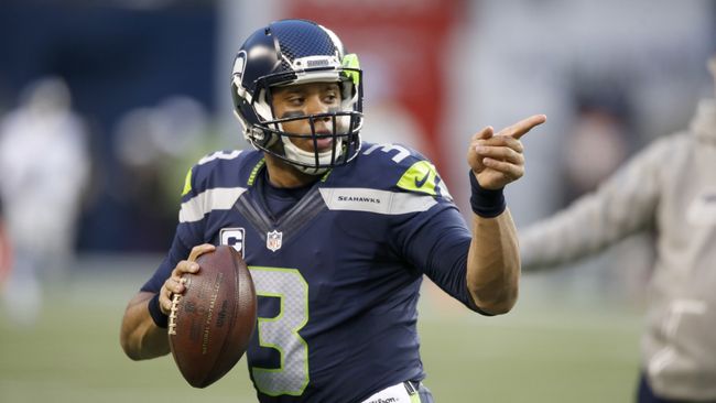 Seattle Seahawks quarterback Russell Wilson directs traffic. 