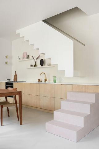 concrete and white staircase in a minimalist kitchen