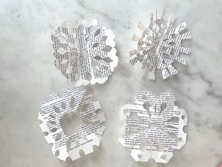 paper snowflakes with book pages