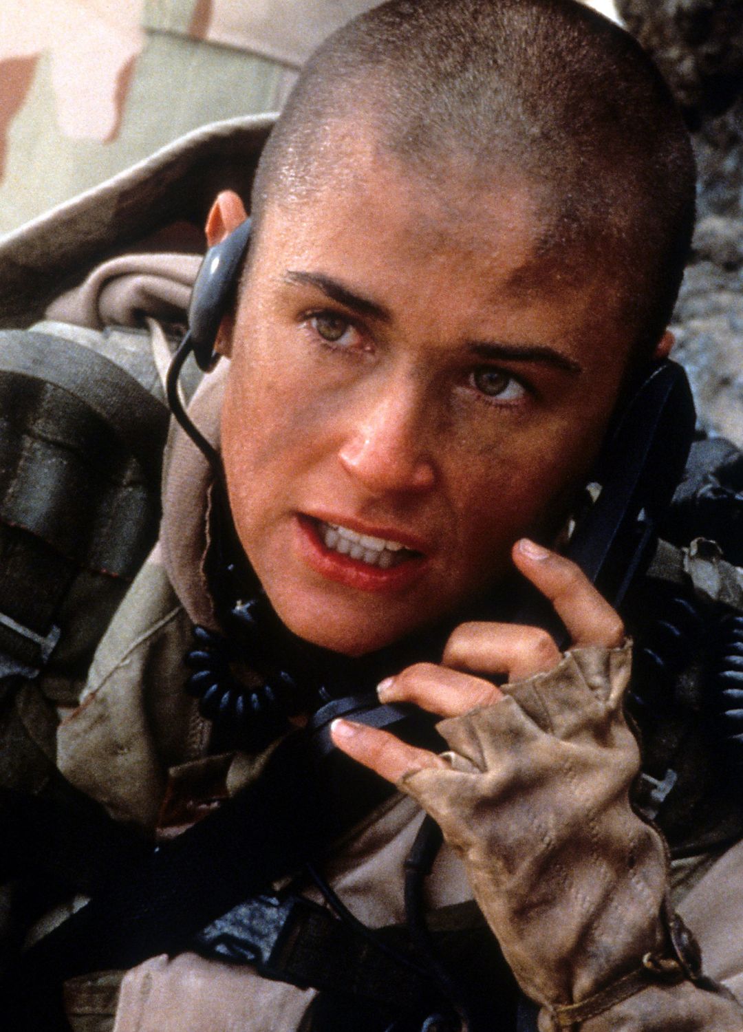 Demi Moore talking on walkie talkie in a scene from the film 'G.I. Jane', 1997