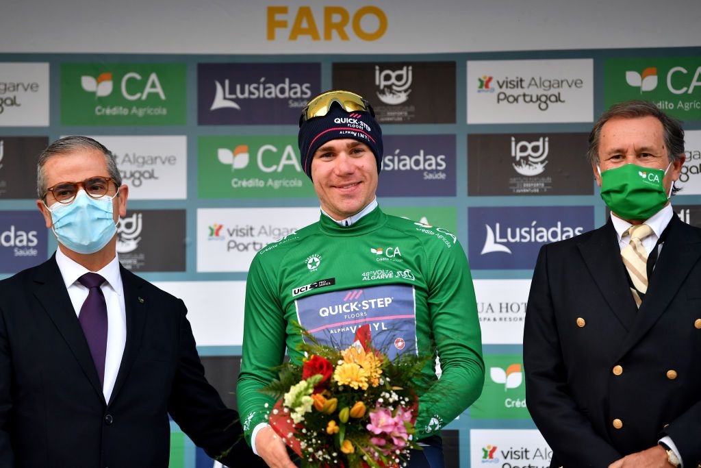 FARO PORTUGAL FEBRUARY 18 Fabio Jakobsen of Netherlands and Team QuickStep Alpha Vinyl celebrates winning the green points jersey on the podium ceremony after the 48th Volta Ao Algarve 2022 Stage 3 a 2114km stage from Almodvar to Faro VAlgarve2022 on February 18 2022 in Faro Portugal Photo by Luc ClaessenGetty Images