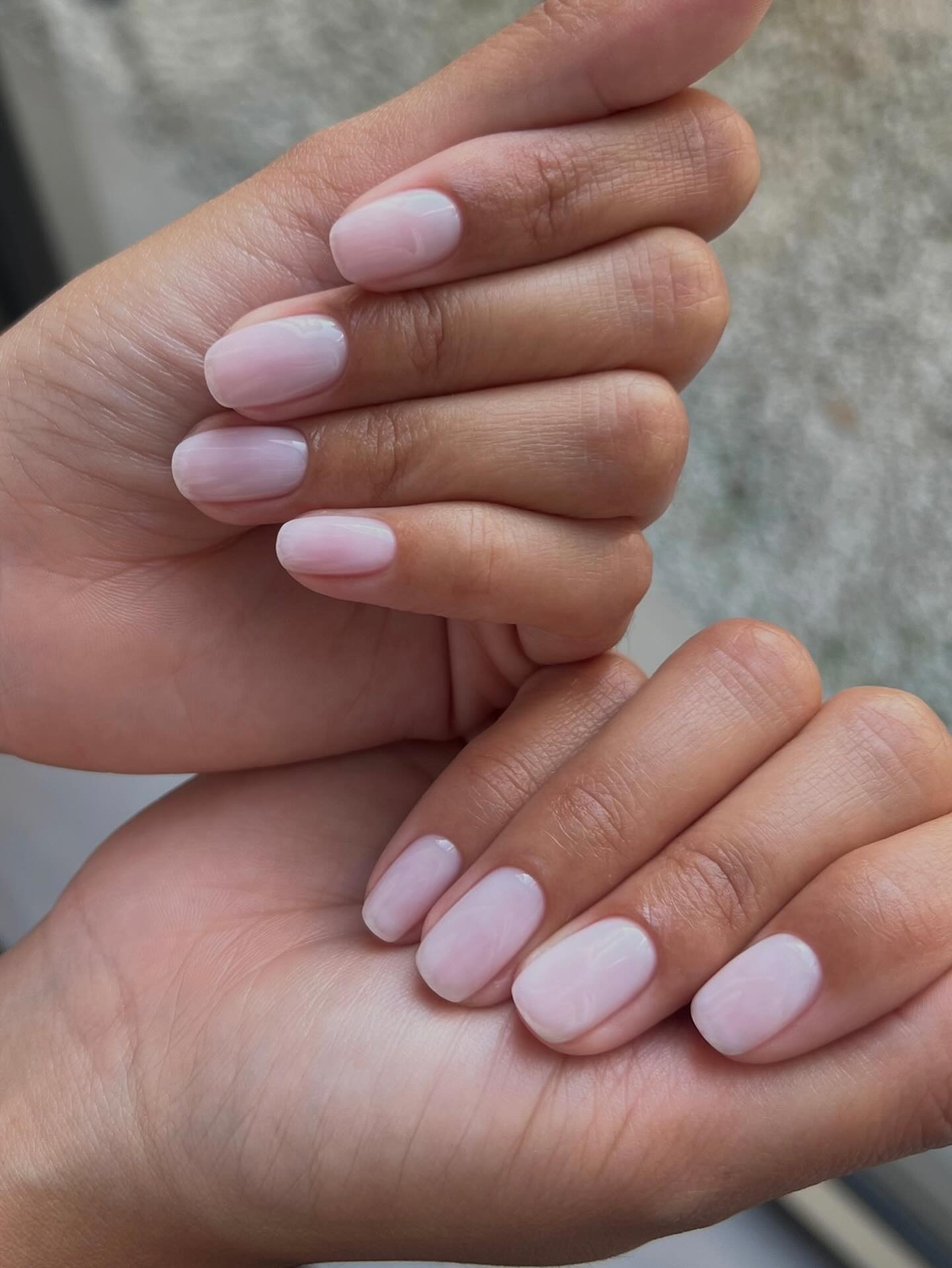 A manicure by @raelondonnails with long squoval nails painted with a porcelain-inspired sheer white naiil polish