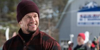 Mark Wahlberg smiling and wearing a hat.