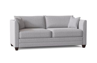 A gray upholstered queen sleeper sofa