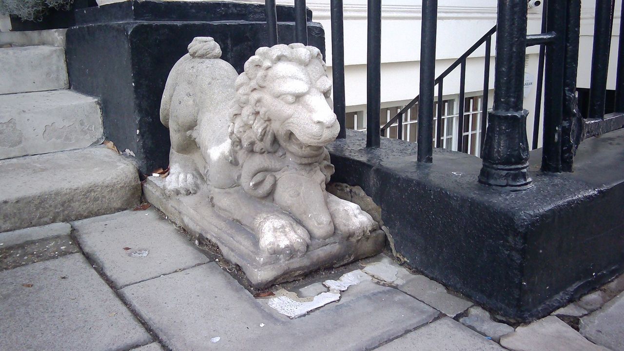 Sample photograph taken with Godox C100, showing close-up view of stone gargoyle