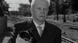 Carlo Battisi holds his dog on the streets of Italy in Umberto D.