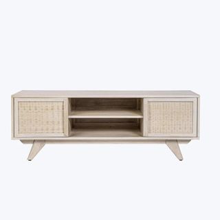 A light wood media unit with woven cabinet doors