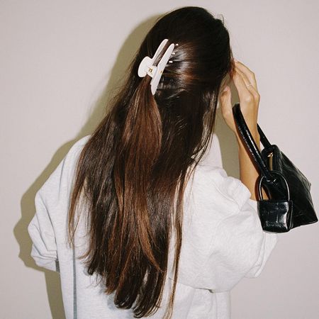 Woman with long, glossy, brown hair