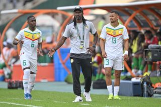 Senegal AFCON 2023 squad: Senegal's head coach Aliou Cisse (C) reacts during the Africa Cup of Nations (CAN) 2024 group C football match between Senegal and Gambia at Stade Charles Konan Banny in Yamoussoukro on January 15, 2024. (Photo by Issouf SANOGO / AFP) (Photo by ISSOUF SANOGO/AFP via Getty Images)