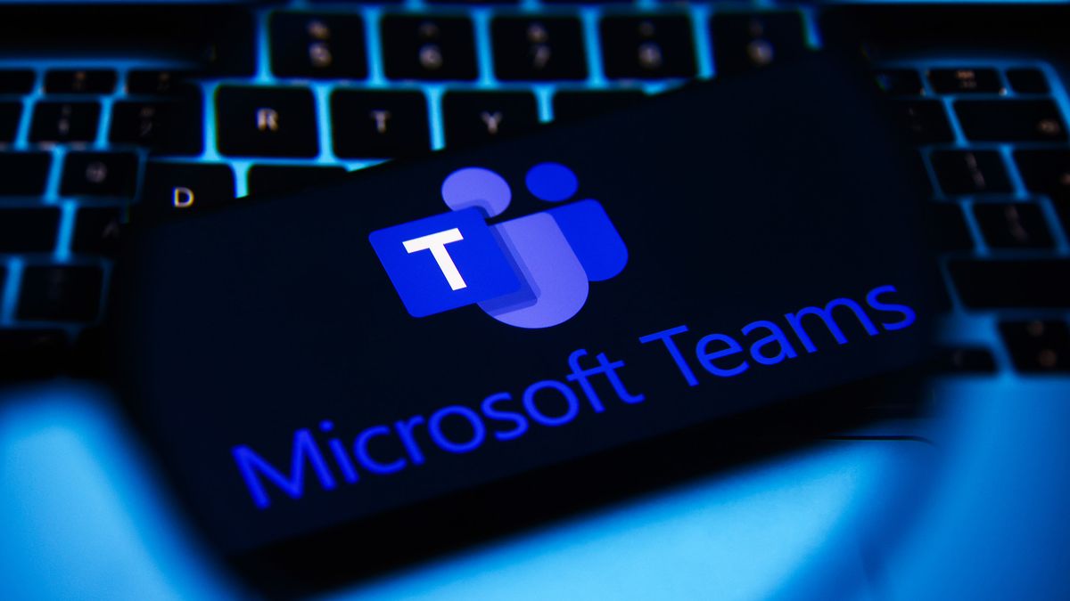 Microsoft Teams logo with a keyboard behind it.