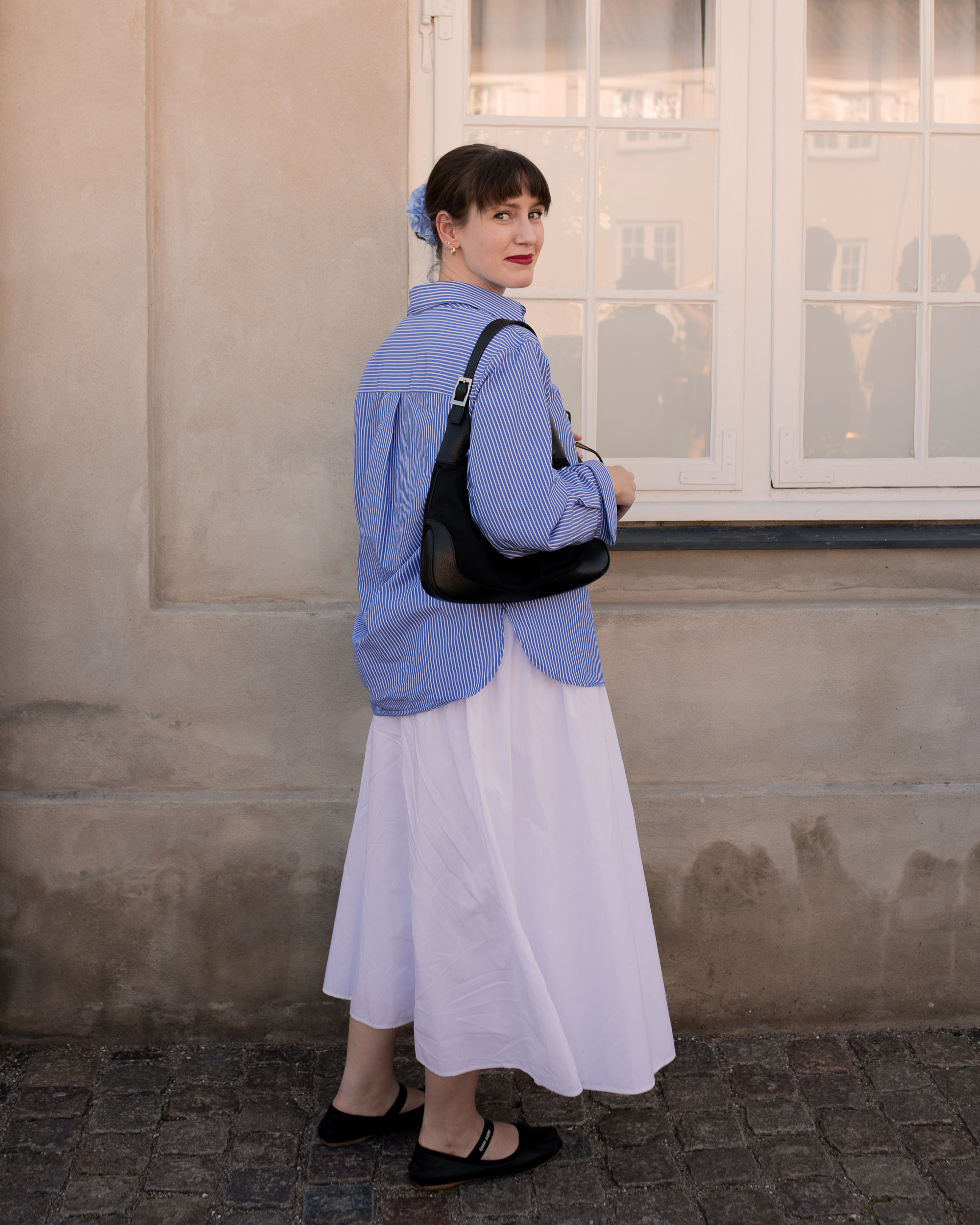 Halie LeSavage wearing a white maxi skirt for the A-list Edit