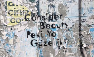 'Consider Beauty' stencilled on wall