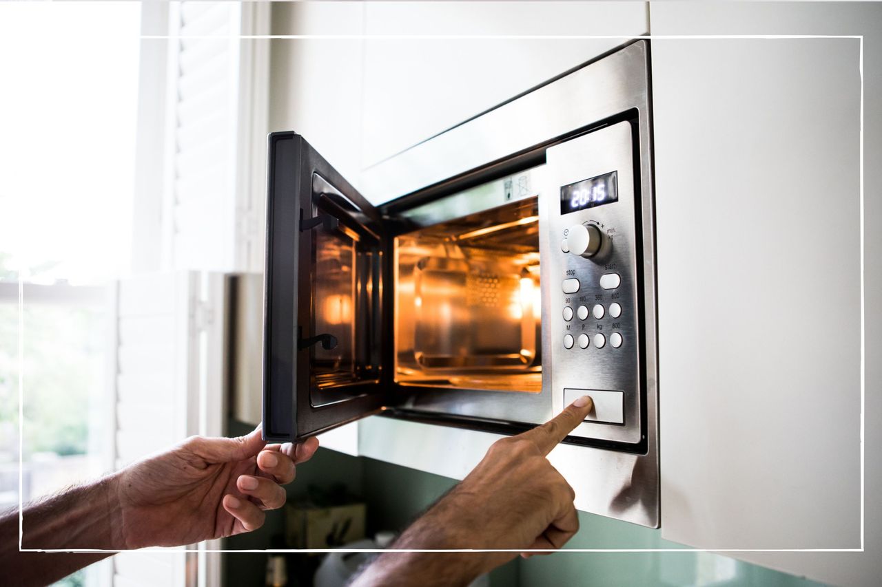 microwave with door open and light on inside