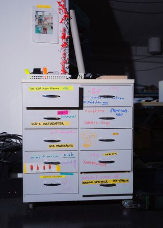 Drawer unit in artist's studio containing art supplies