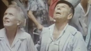 Two older people looking up in amazement