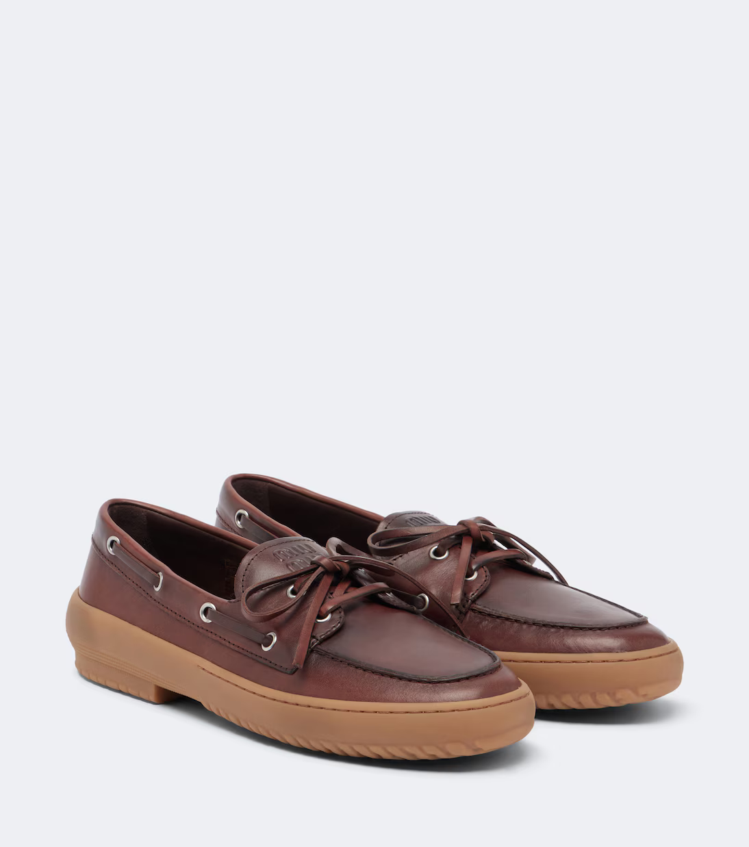 A pair of Miu Miu boat shoes.