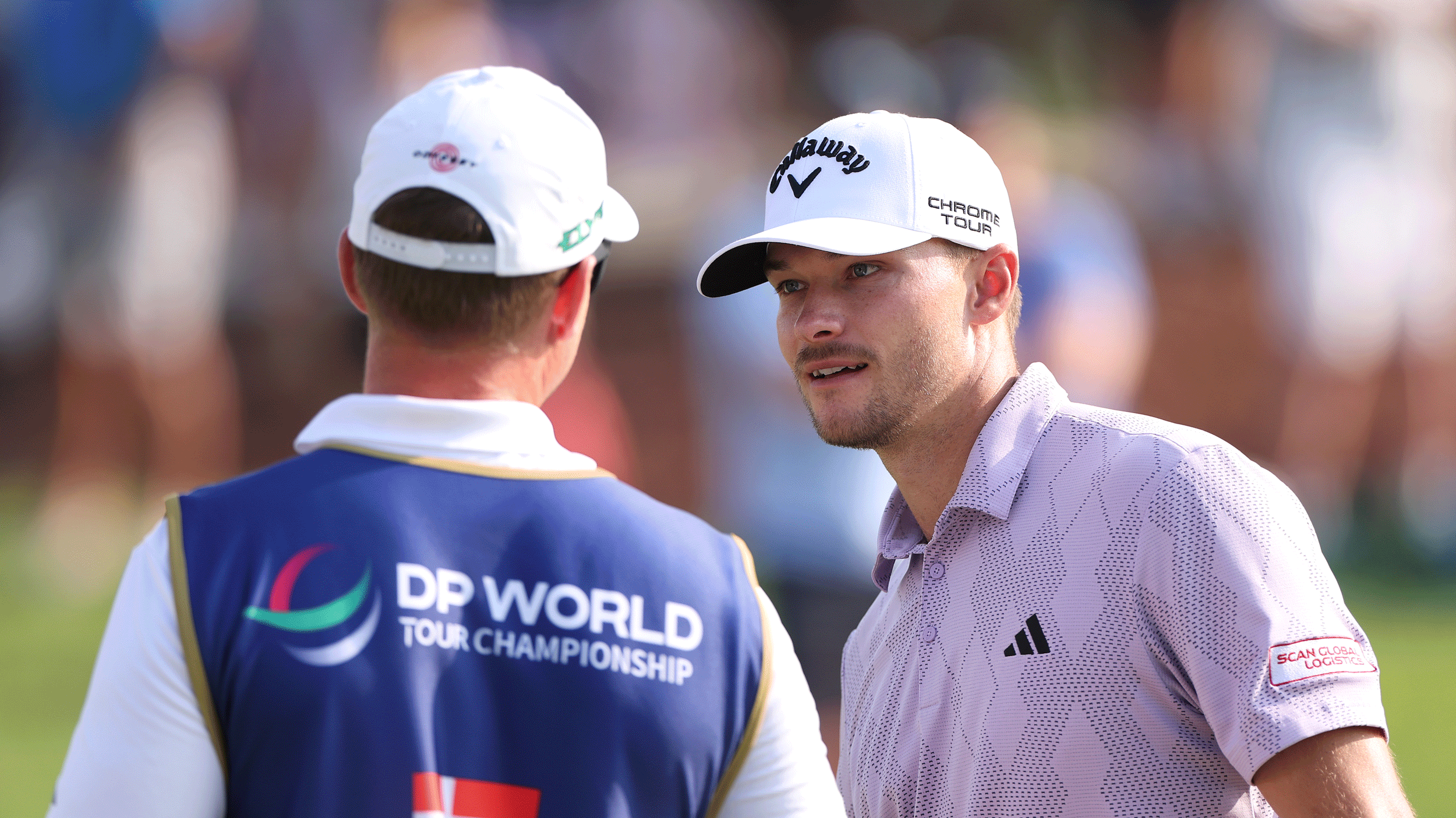 Nicolai Hojgaard speaks to his caddie during round two of the 2025 DP World Tour Championship