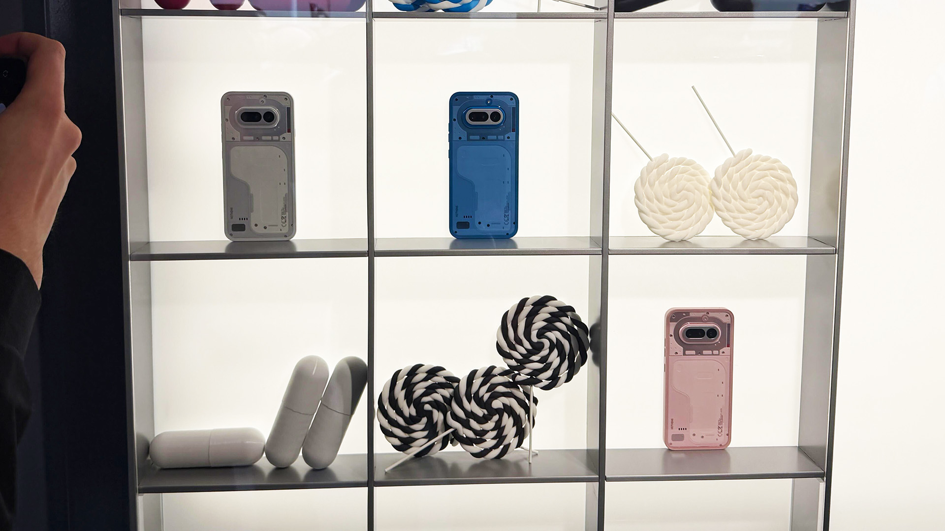 Nothing Phone (4a) on MWC 2026 stand &amp;ndash; in blue, pink and white