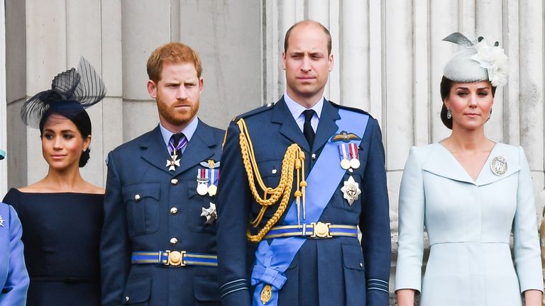 Meghan, Duchess of Sussex, Prince Harry, Duke of Sussex, Prince William, Duke of Cambridge and Catherine, Duchess of Cambridge stand on the balcony of Buckingham Palace to view a flypast to mark the centenary of the Royal Air Force (RAF) on July 10, 2018 in London, England