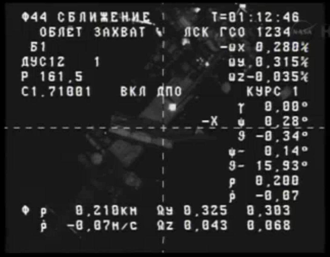 The International Space Station looms as the Russian Progress 53 ship approaches the orbiting outpost to deliver tons of supplies.