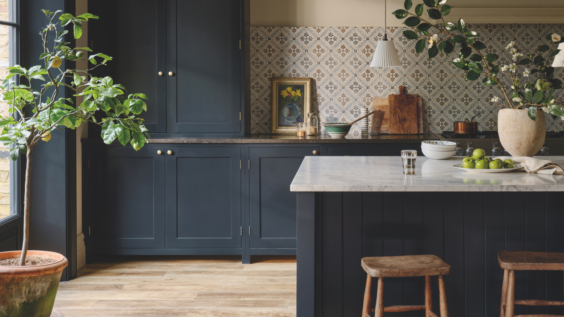 Blue kitchen with Fired Earth wood-effect and Nina Campbell tiles