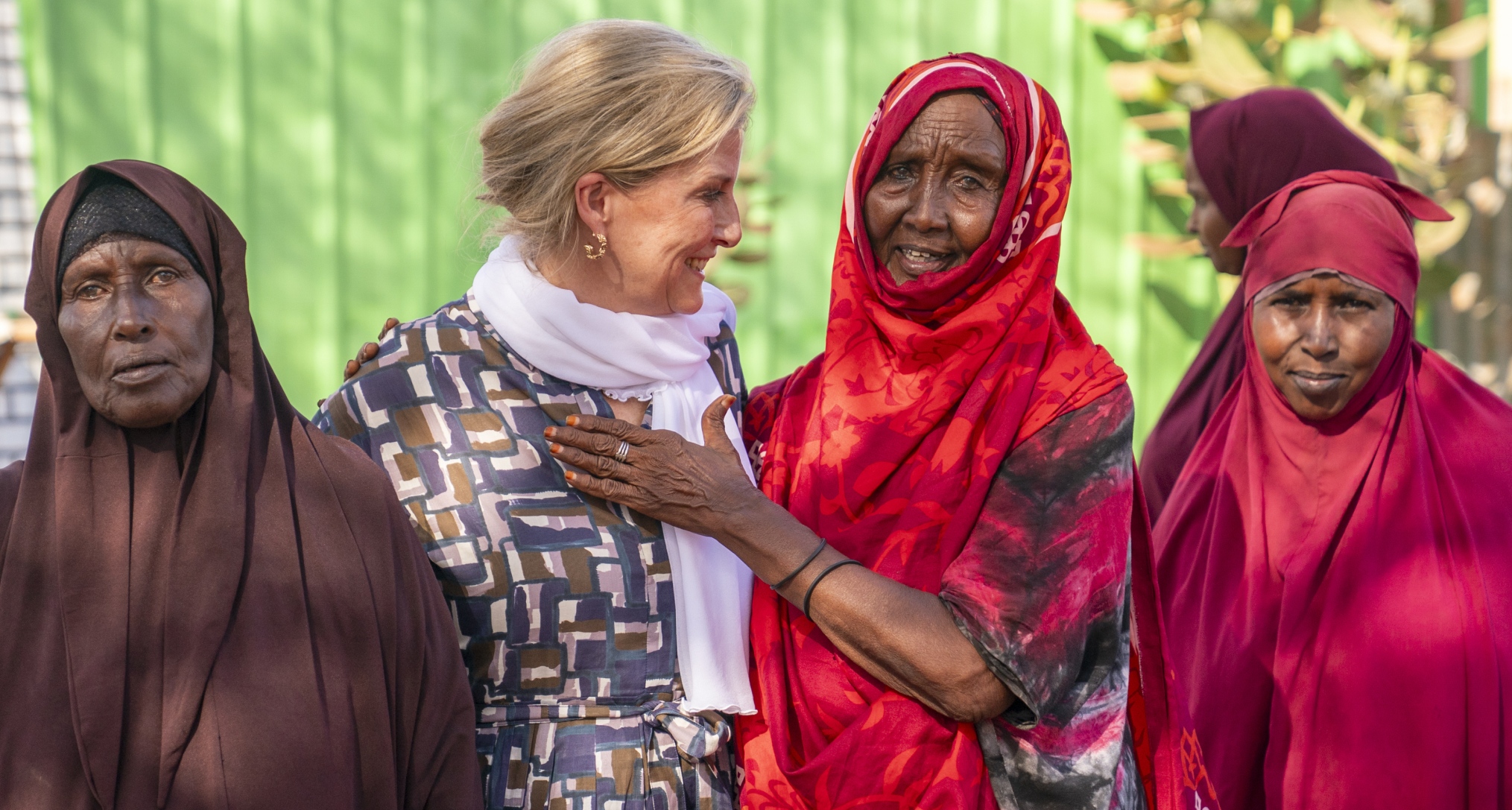 Duchess Sophie with her arms around Somalian women