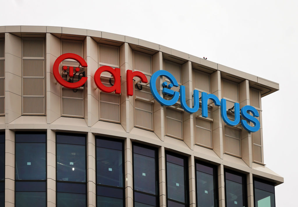 CarGurus sign in red and blue on top of a building in Boston, Massachusetts