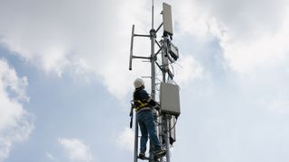 Worker is installing 5G Telecommunication Base Station
